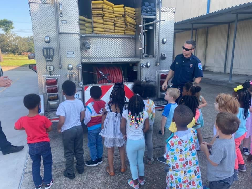 Firefighter Minton showing back of truck