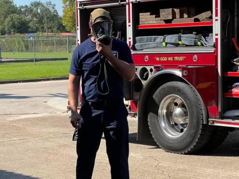 Captain Spaid donning SCBA mask