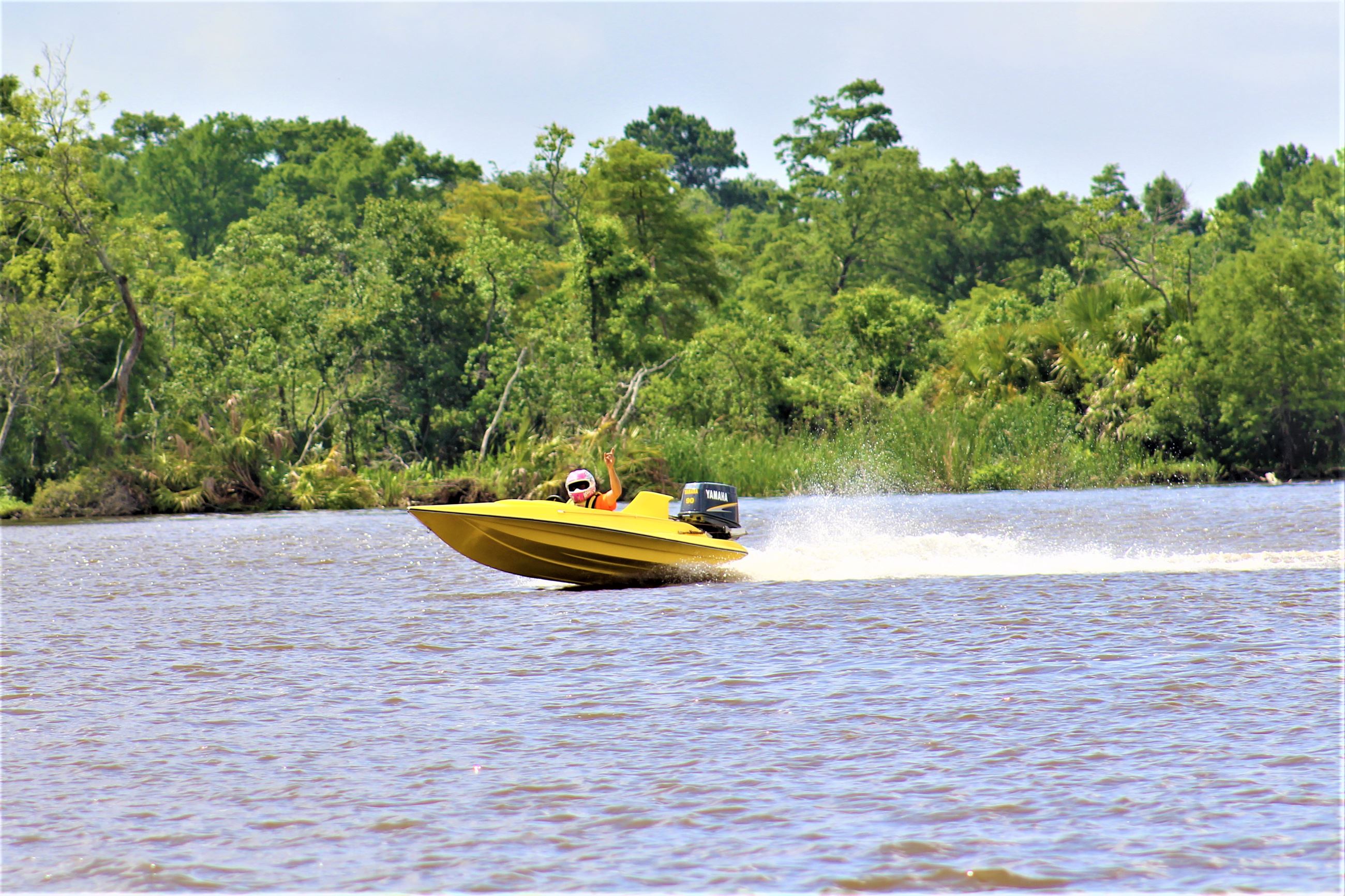 Man Racing in Boat